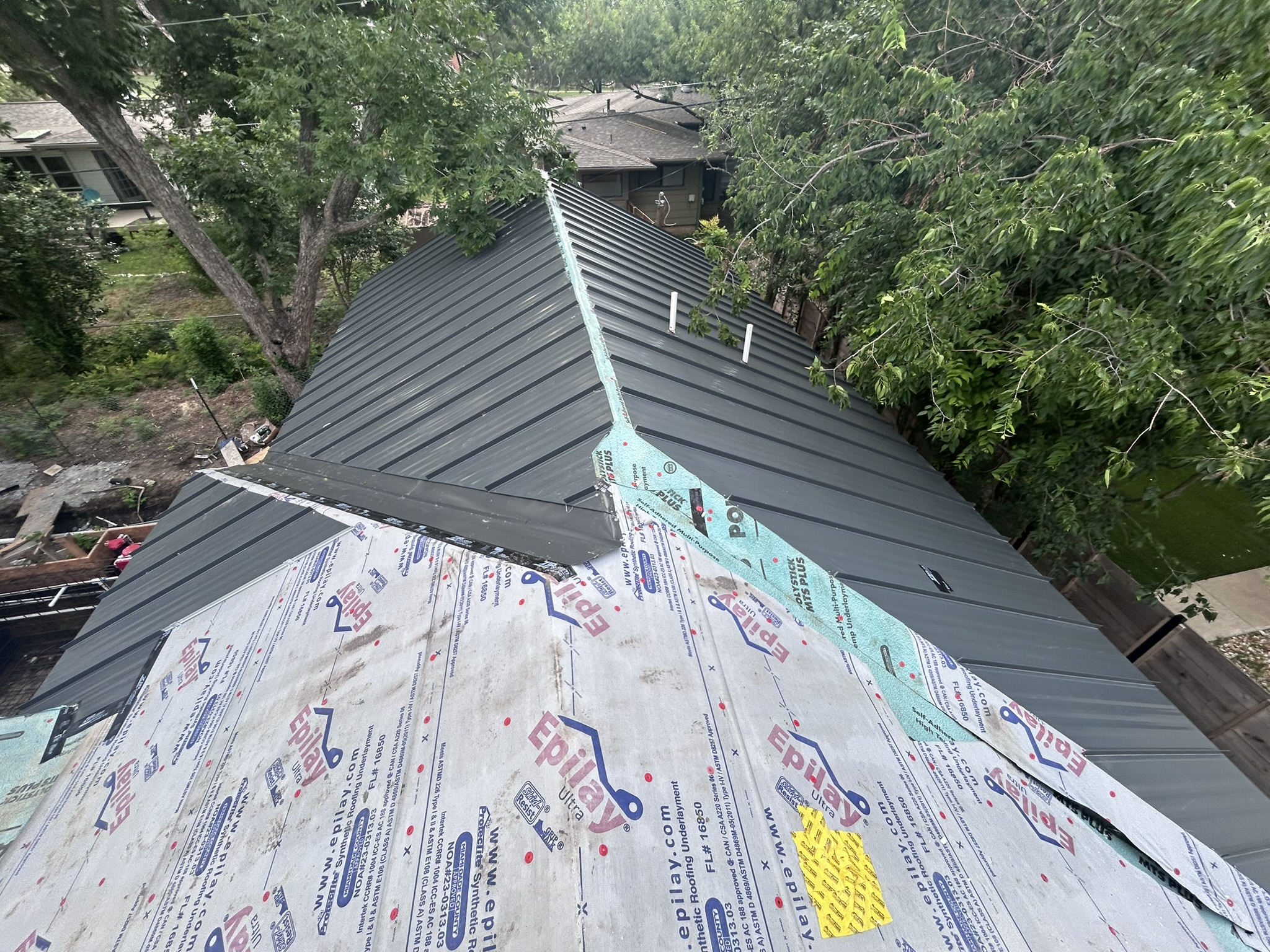 Finished standing-seam metal roof by Portillo Roofing